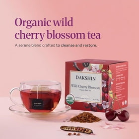 DAKSHIN Organic Wild Cherry Blossom tea bags steeping in cup for a calming ritual.