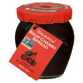 Dalmatia sour cherry spread jar on a cheese board enhancing cheese pairing