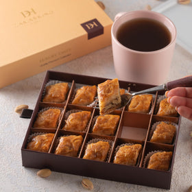 Damaskino Home walnut baklava pastries collection highlighting buttery phyllo and walnut filling.