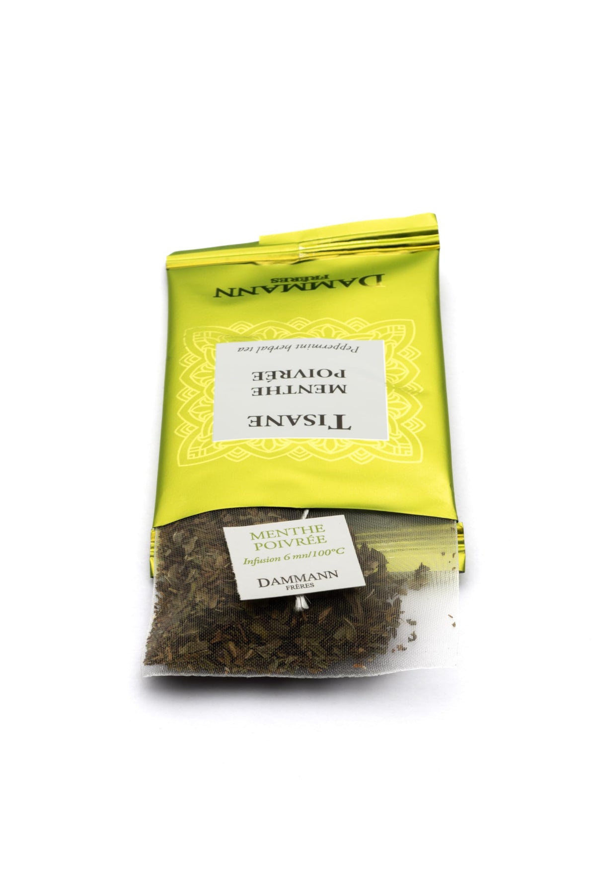 Dammann Frères peppermint tea bag closeup, vibrant menthol notes for a crisp, refreshing cup.