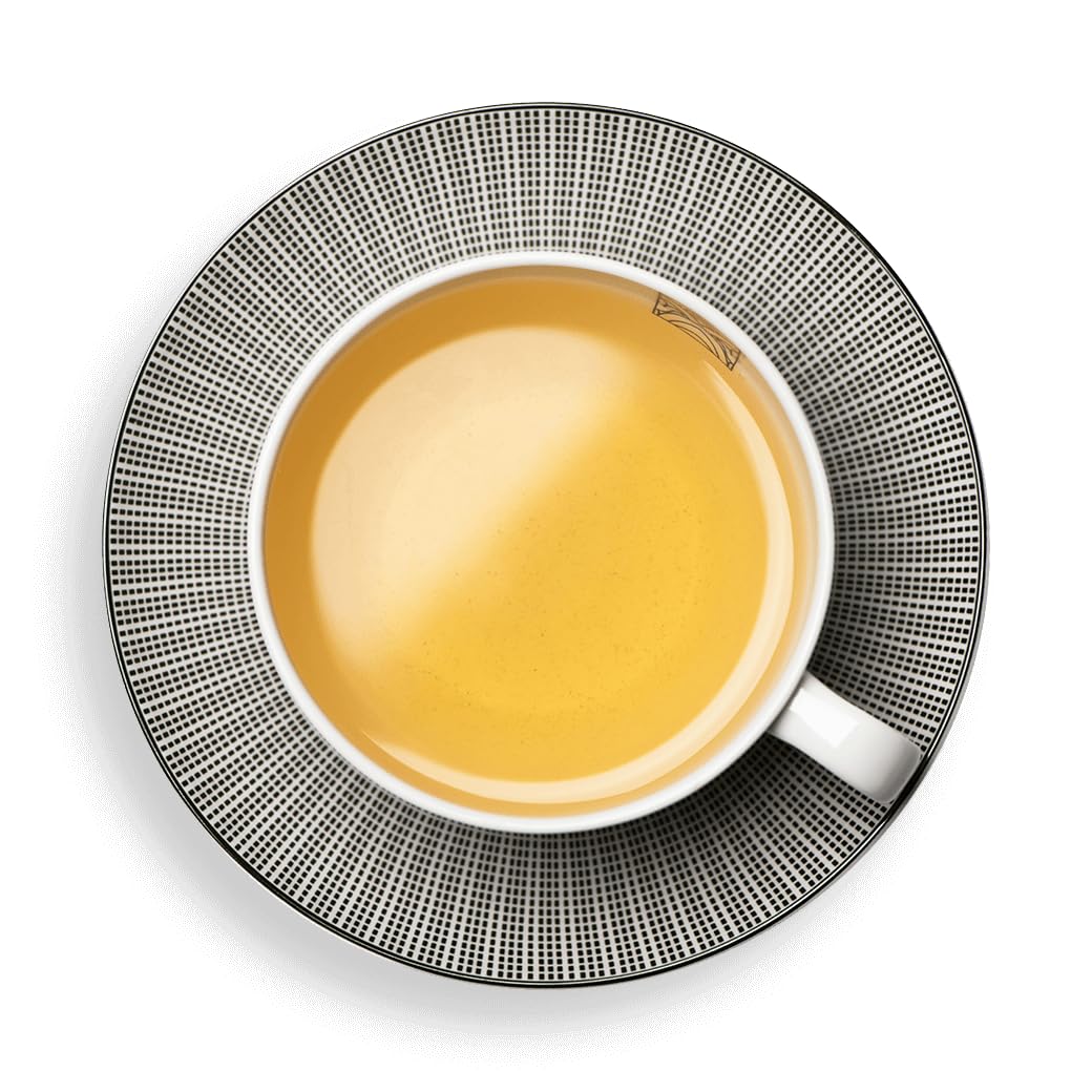 Dammann Freres Tea brewing in a glass cup showcases vibrant color.