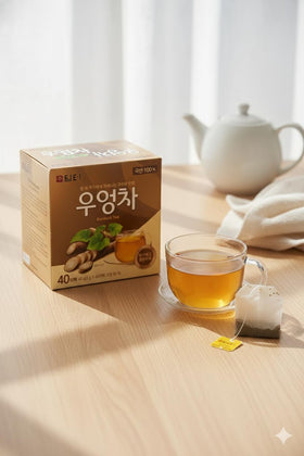 Damtuh Burdock Tea served cold in a glass, refreshing herbal sip.