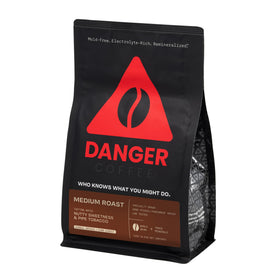 Danger Coffee bag front with premium whole beans.