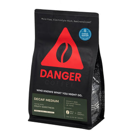 Danger Coffee Swiss Water decaf whole bean bag branding for a pure decaf experience.