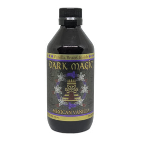 Dark Magic vanilla extract close-up showing real vanilla beans inside