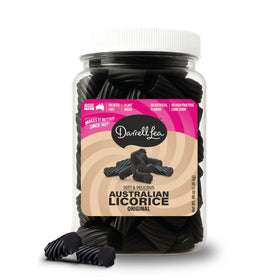 Darrell Lea Original Black Licorice bulk tub close-up, soft and chewy pieces for snacking.