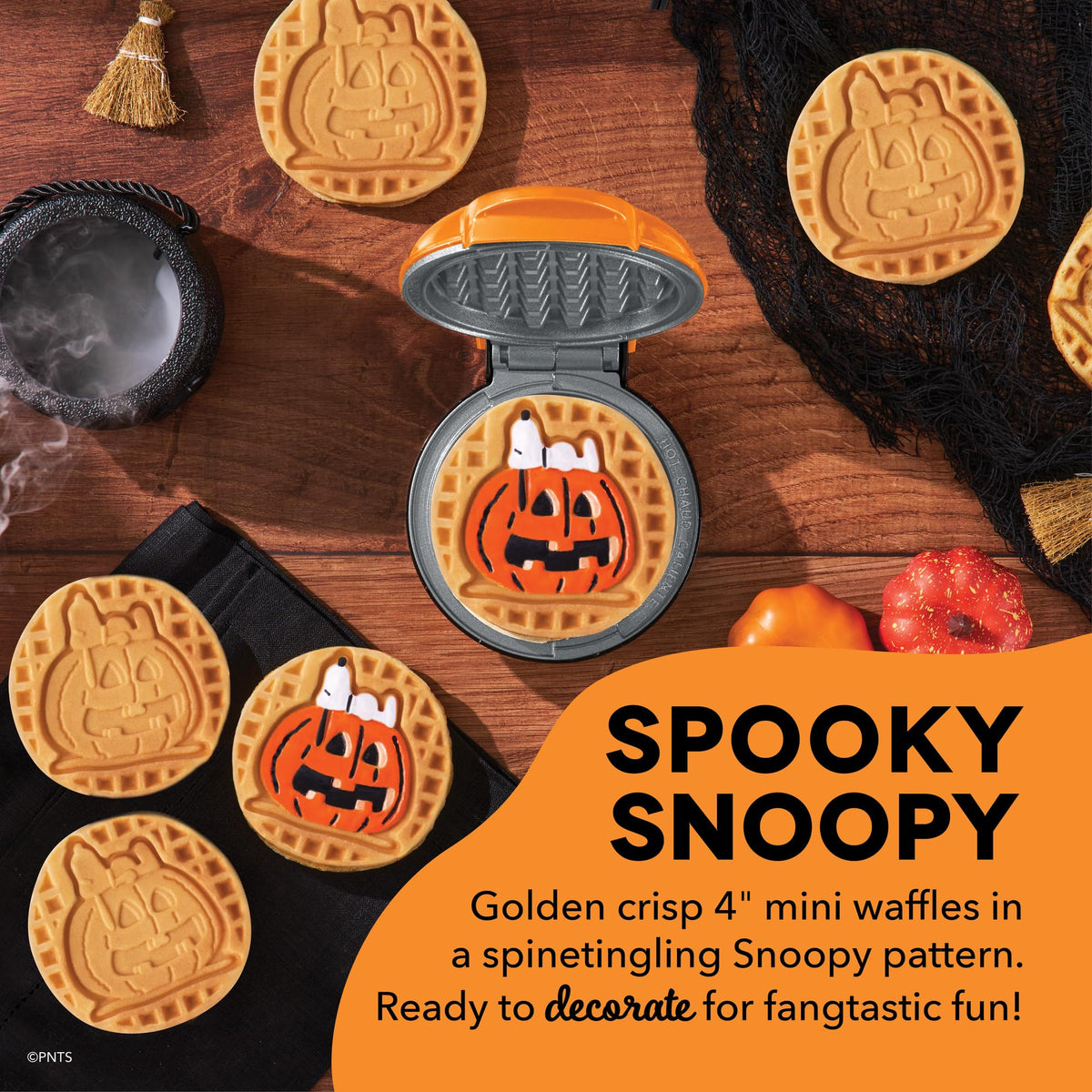 DASH Snoopy waffles with pumpkin print ready for festive, kid-friendly treats.