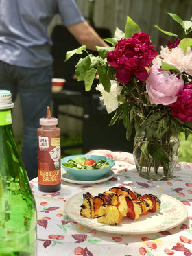 Date Lady BBQ Sauce served at a family dinner table.
