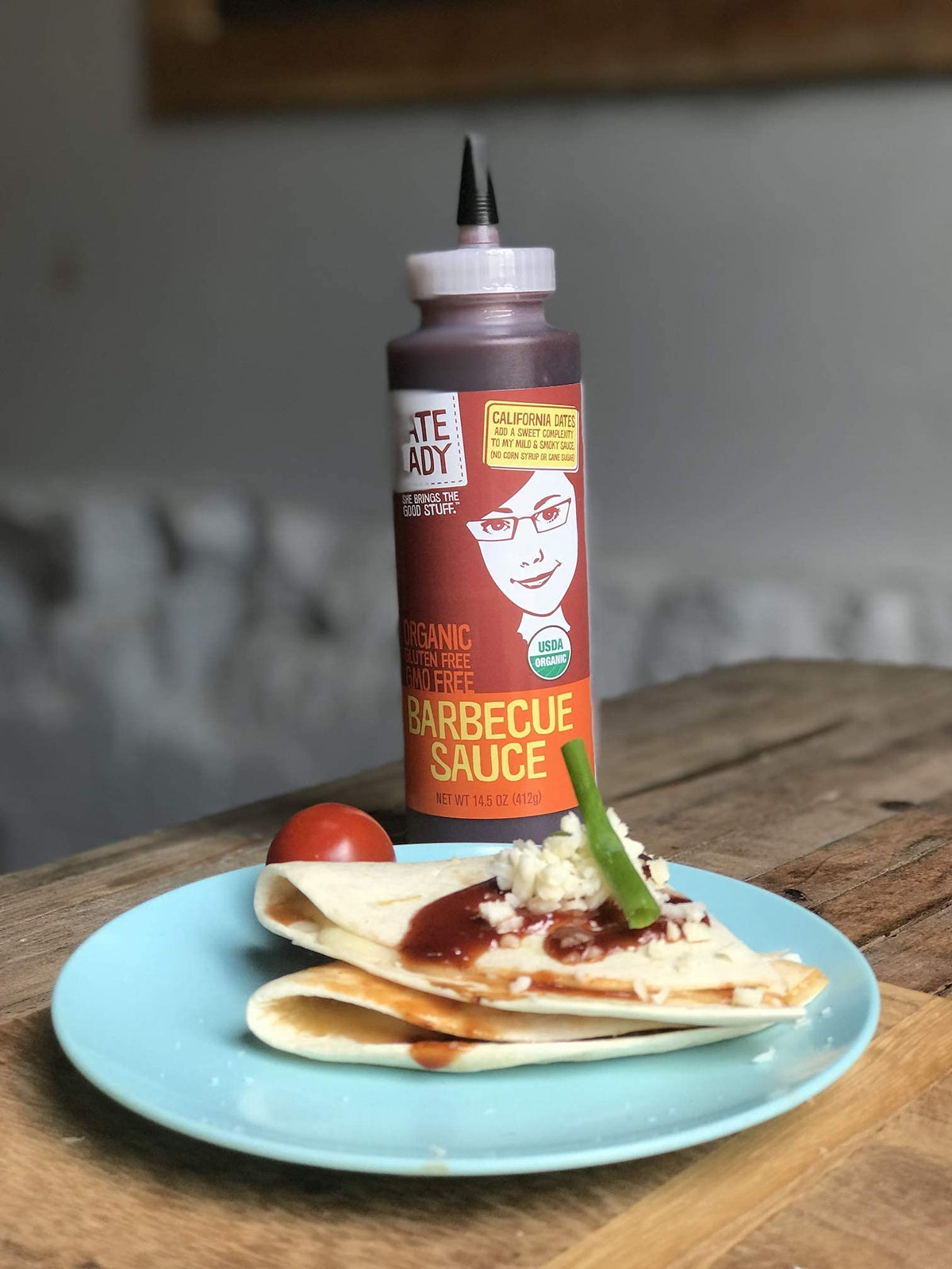 Date Lady BBQ Sauce us-made label on bottle emphasizing small-batch quality.
