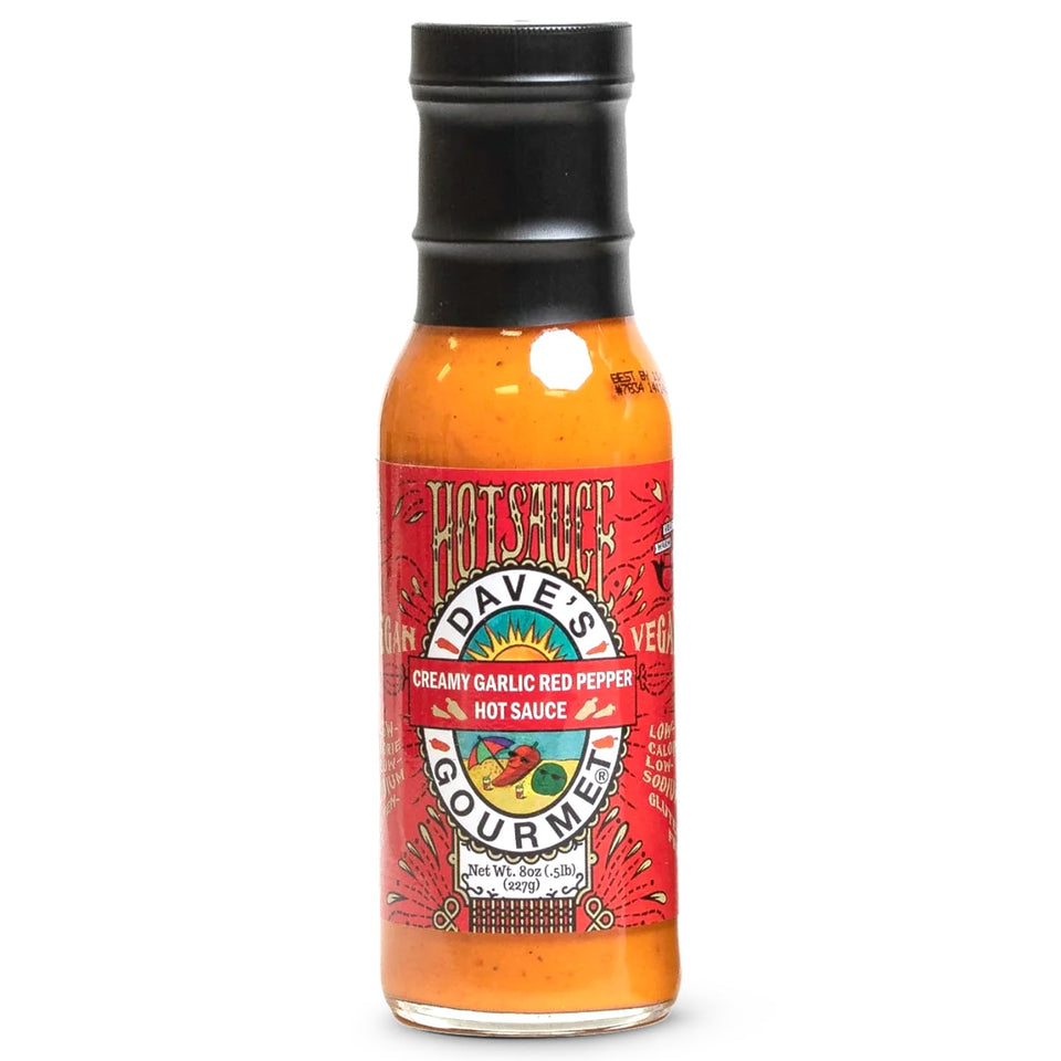 Dave's Gourmet Creamy Garlic Red Pepper Sauce bottle for dipping and grilling.