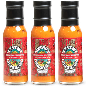 Dave's Gourmet creamy garlic red pepper sauce bottle showing rich color and creamy texture for versatile meals