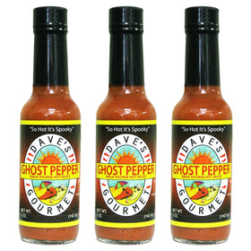 Dave's Gourmet Ghost Pepper bottle pour shows creeping heat for wings