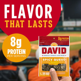 Close-up of DAVID Spicy Queso sunflower seeds with roasted texture and crunchy bite.