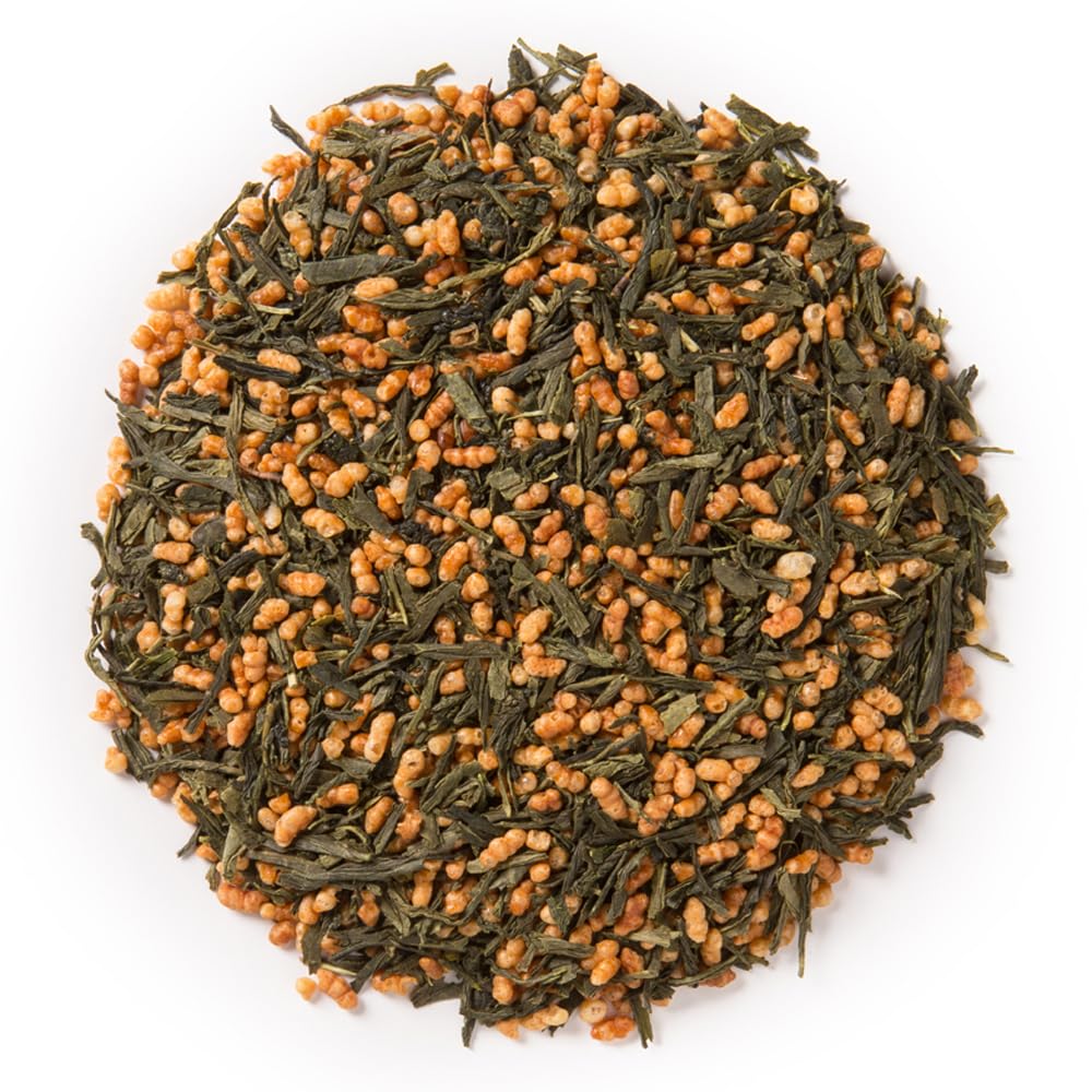 Dry Genmaicha leaves in a scoop; showcasing green-tea and roasted brown rice aroma ideal for tea-tasting moments.