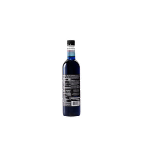Pouring DaVinci Gourmet Blue Raspberry syrup for vibrant blue drinks.