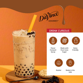 Pouring DaVinci Gourmet Brown Sugar Syrup enhances cappuccinos with molasses notes.