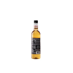 DaVinci Gourmet Classic Butterscotch Syrup being poured adds decadent drink sweetness.