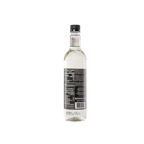 DaVinci Gourmet Classic Coconut Syrup being poured into a glass for a tropical twist