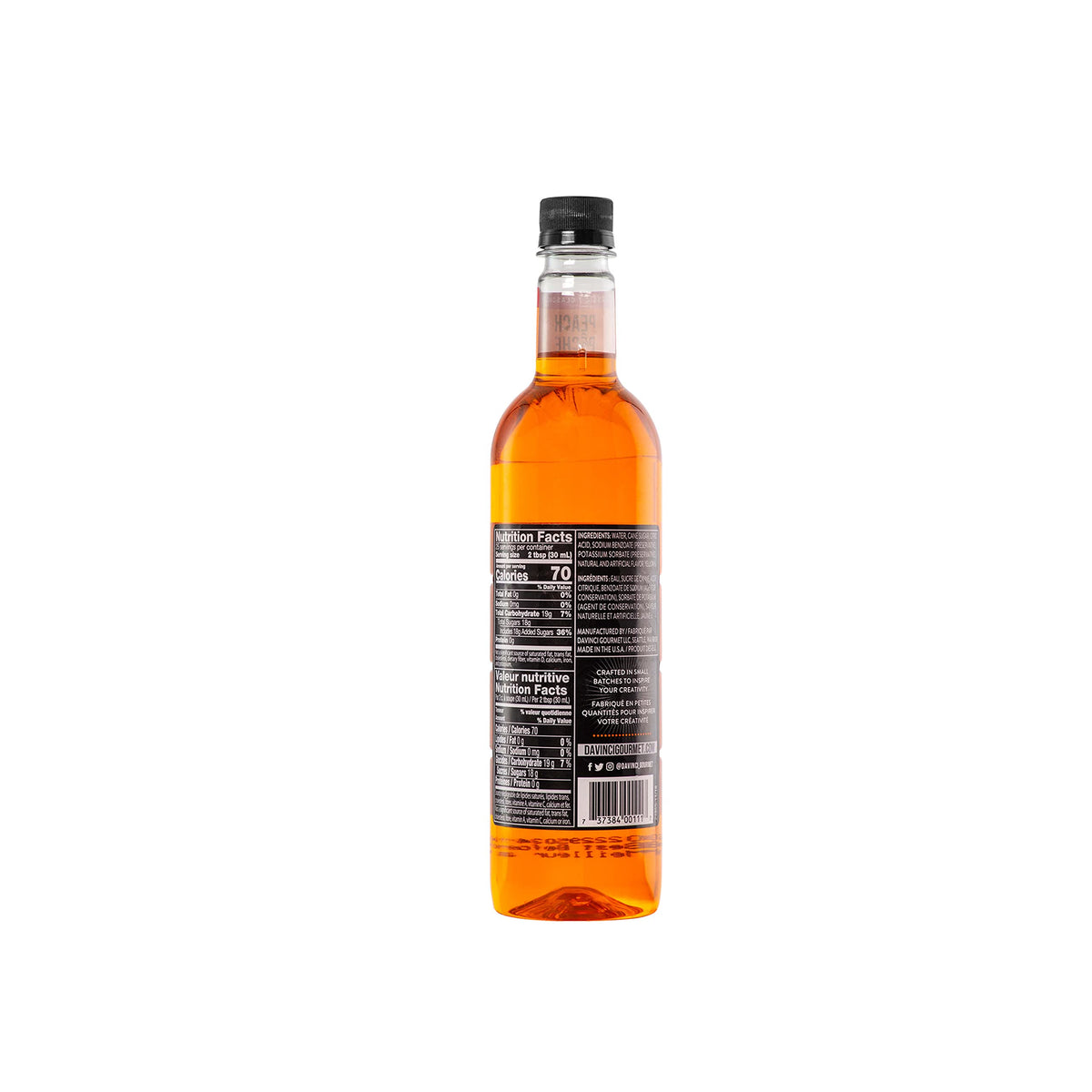 DaVinci Gourmet Classic Peach Syrup is poured into a cold drink for flavor.