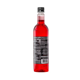 DaVinci Gourmet Classic Strawberry Syrup being poured into a cup for hot drink