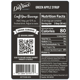 Pouring DaVinci Green Apple Syrup into a bright mocktail.
