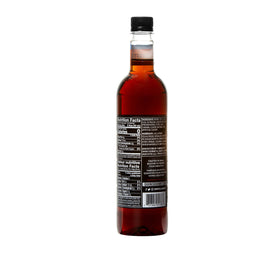 Pouring DaVinci Gourmet Amaretto into coffee adds nutty almond notes