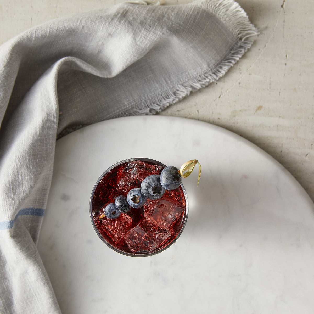 Snow cone preparation with blueberry syrup for a refreshing treat