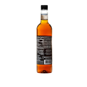 DaVinci Gourmet Sugar Free Butter Rum Syrup pour scene highlights versatile flavor for cocktails.