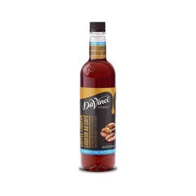 DaVinci Gourmet sugar-free coffee liqueur syrup bottle pouring into espresso for sugar-free drinks.