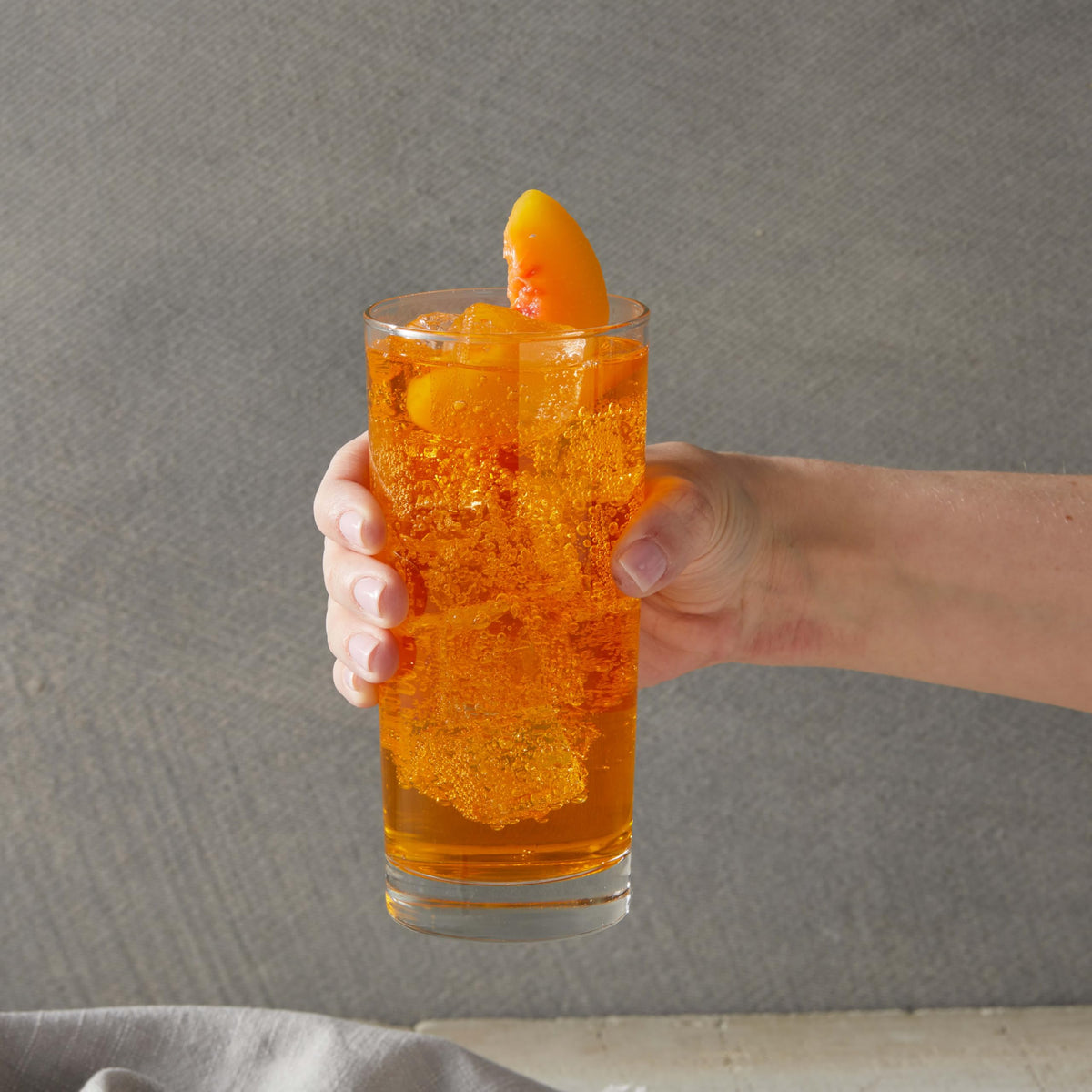 DaVinci Gourmet peach syrup in home kitchen for everyday flavoring.
