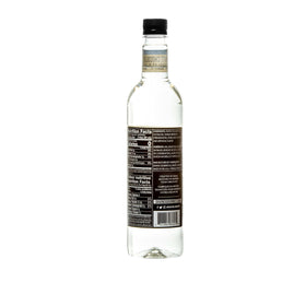 DaVinci Gourmet Sugar-Free White Chocolate Syrup bottle pours to reveal rich flavor.