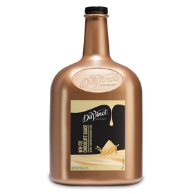 DaVinci Gourmet White Chocolate Sauce bottle pour highlighting creamy texture.