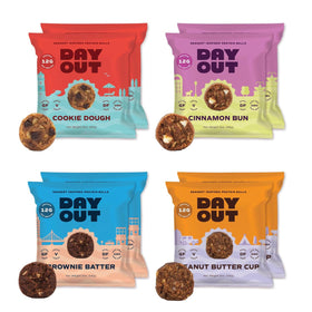 Day Out Protein Snack Balls variety pack in hand, convenient on-the-go energy bites.