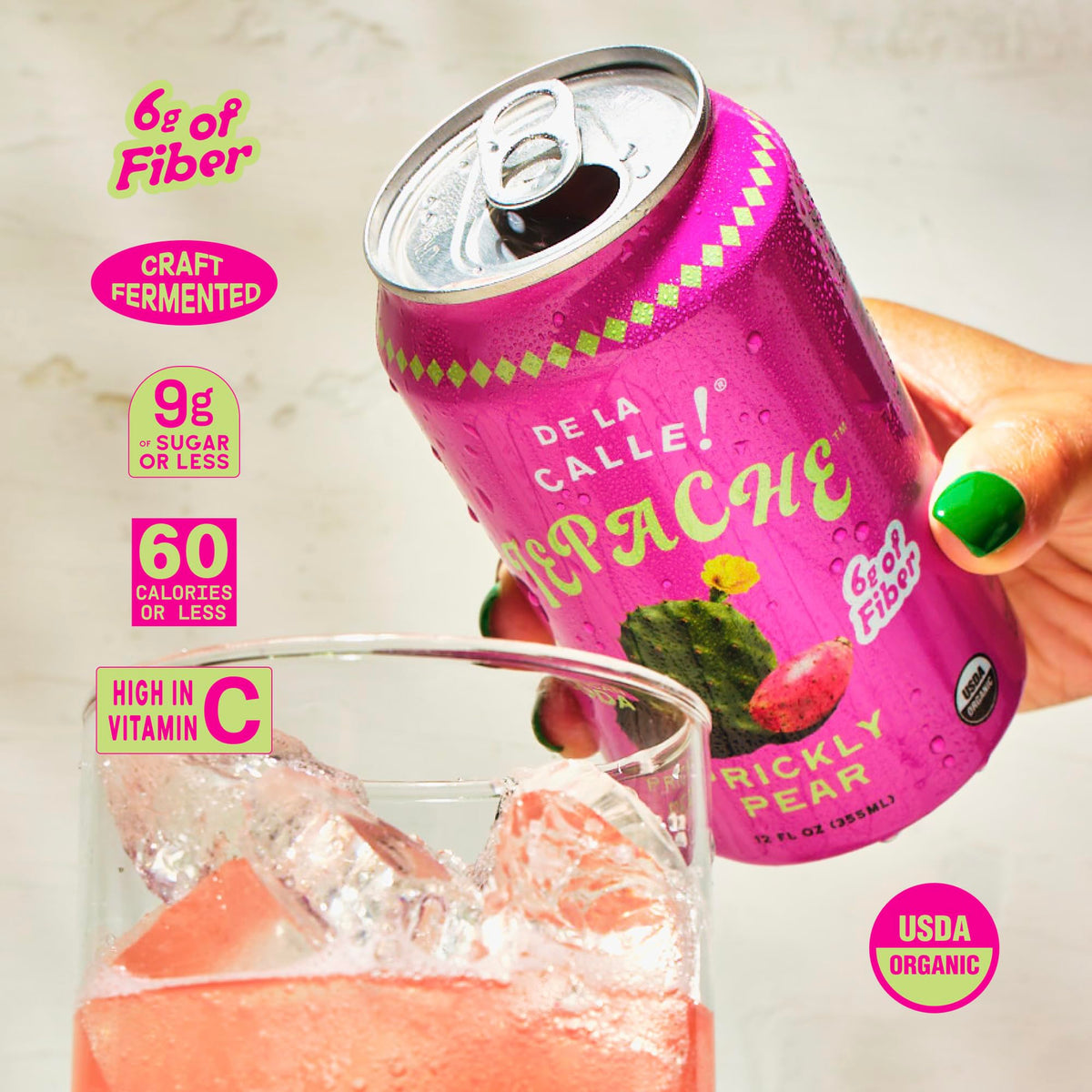 De La Calle Tepache bottle side reveals rustic glass and vivid, sparkling ingredients.