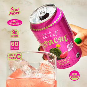 De La Calle Tepache bottle side reveals rustic glass and vivid, sparkling ingredients.