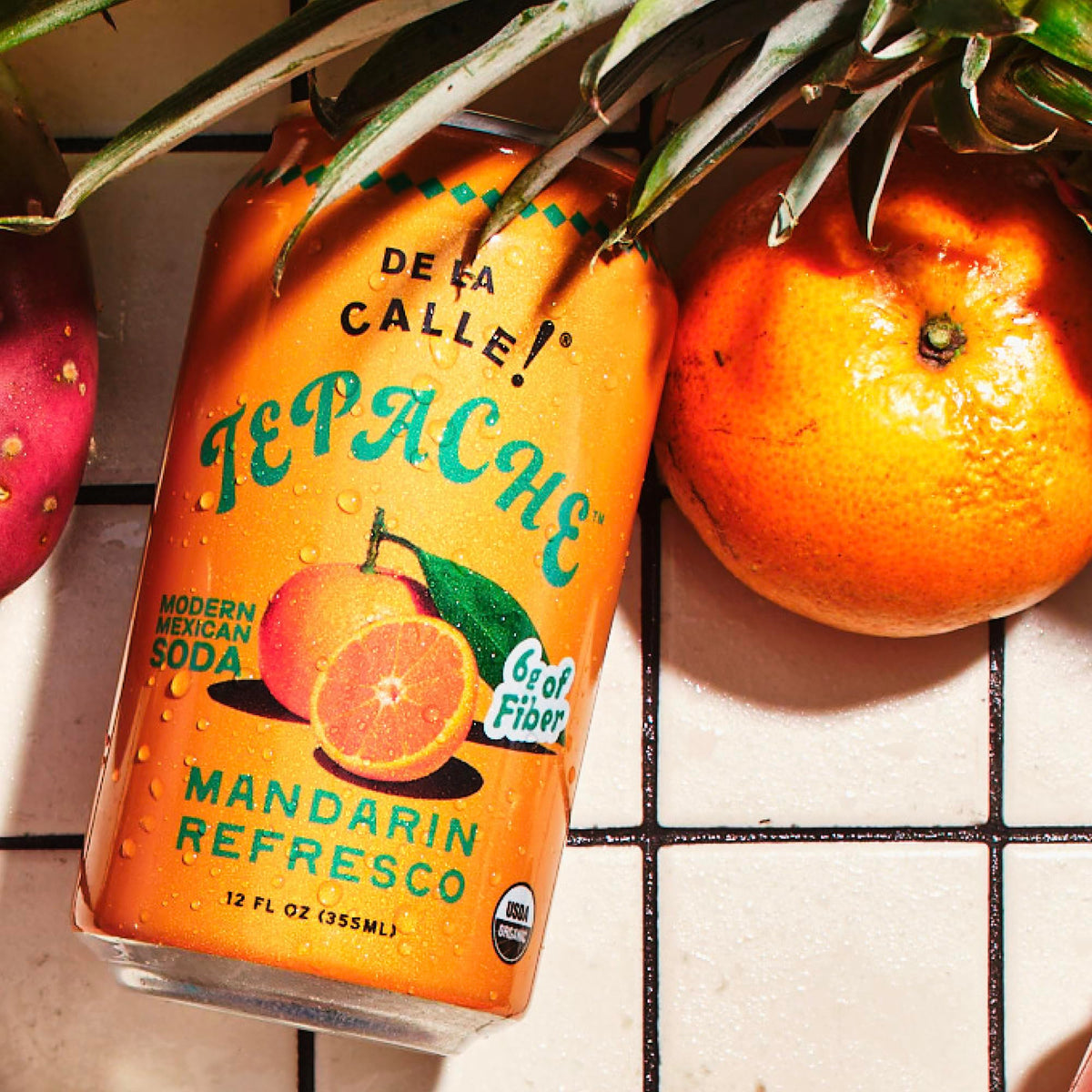 De La Calle Tepache Mandarin ingredients closeup emphasizing pineapple and spices in an organic recipe