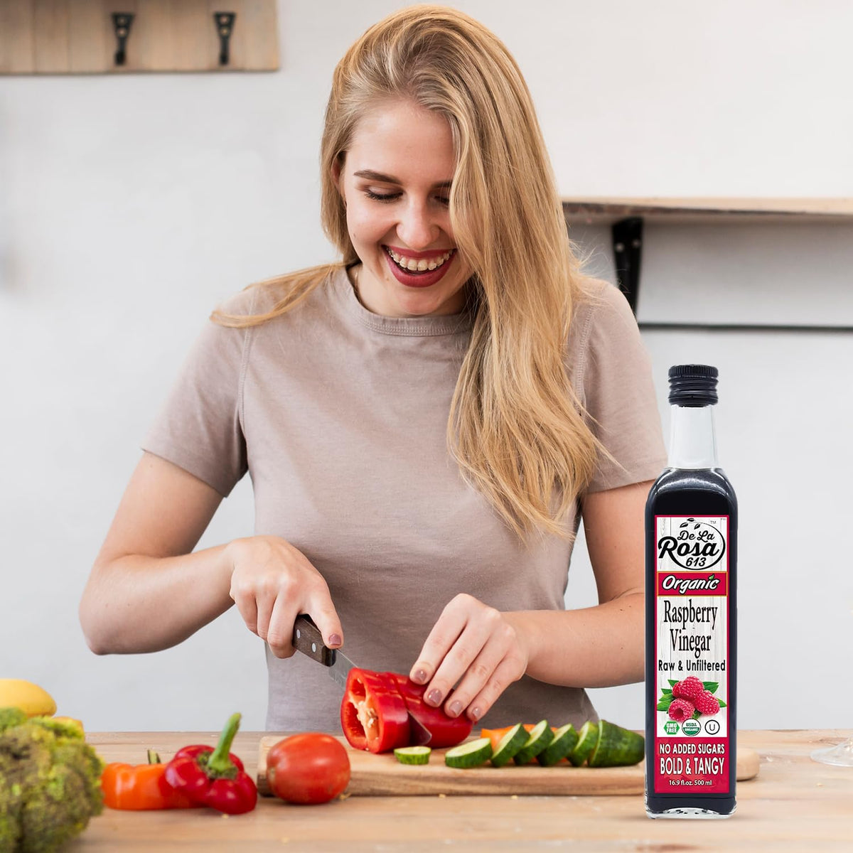 Elegant glass packaging showcases De La Rosa 613 raspberry vinegar.