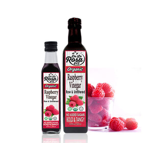 Elegant packaging display of De La Rosa 613 raspberry vinegar bottle.