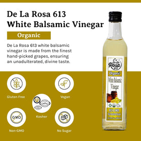 Pouring De La Rosa 613 white balsamic into a clear glass for a salad