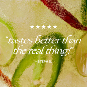 De Soi Haute Margarita dramatic pour into a glass with bubbles.