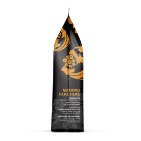 Death Wish Coffee coconut caramel ground coffee in a mug ready for a powerful start