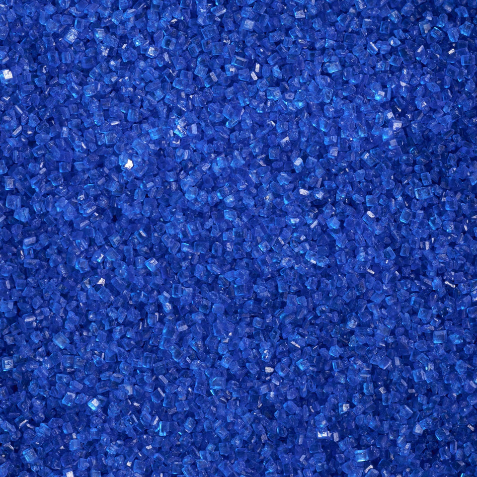 DecoPac dark blue sanding sugar in a handheld jar for cake decorating.