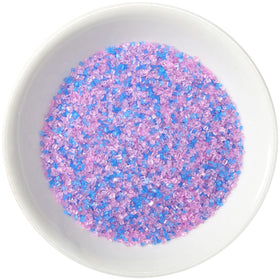 Handheld container of DecoPac sprinkles for easy pouring and control.