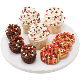 DecoPac Mickey Mouse quins sprinkled on cupcakes for festive tops.