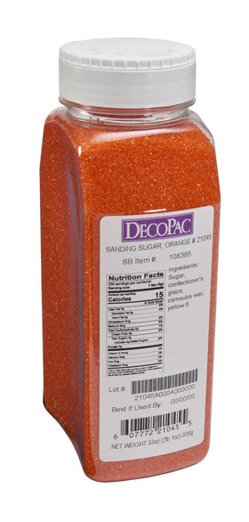 Orange DecoPac edible sprinkles on cake for bright color and finish.
