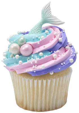 DecoPac white nonpareils folded into icing for even color distribution.