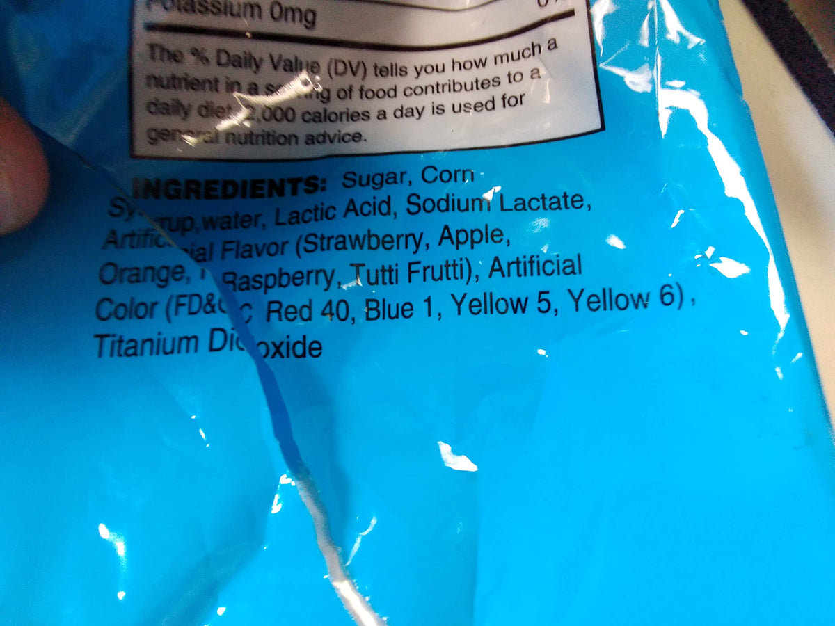 Dee Best Bricks on Stix brick lollipops shown in a party loot bag setup