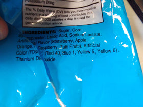 Dee Best Bricks on Stix brick lollipops shown in a party loot bag setup