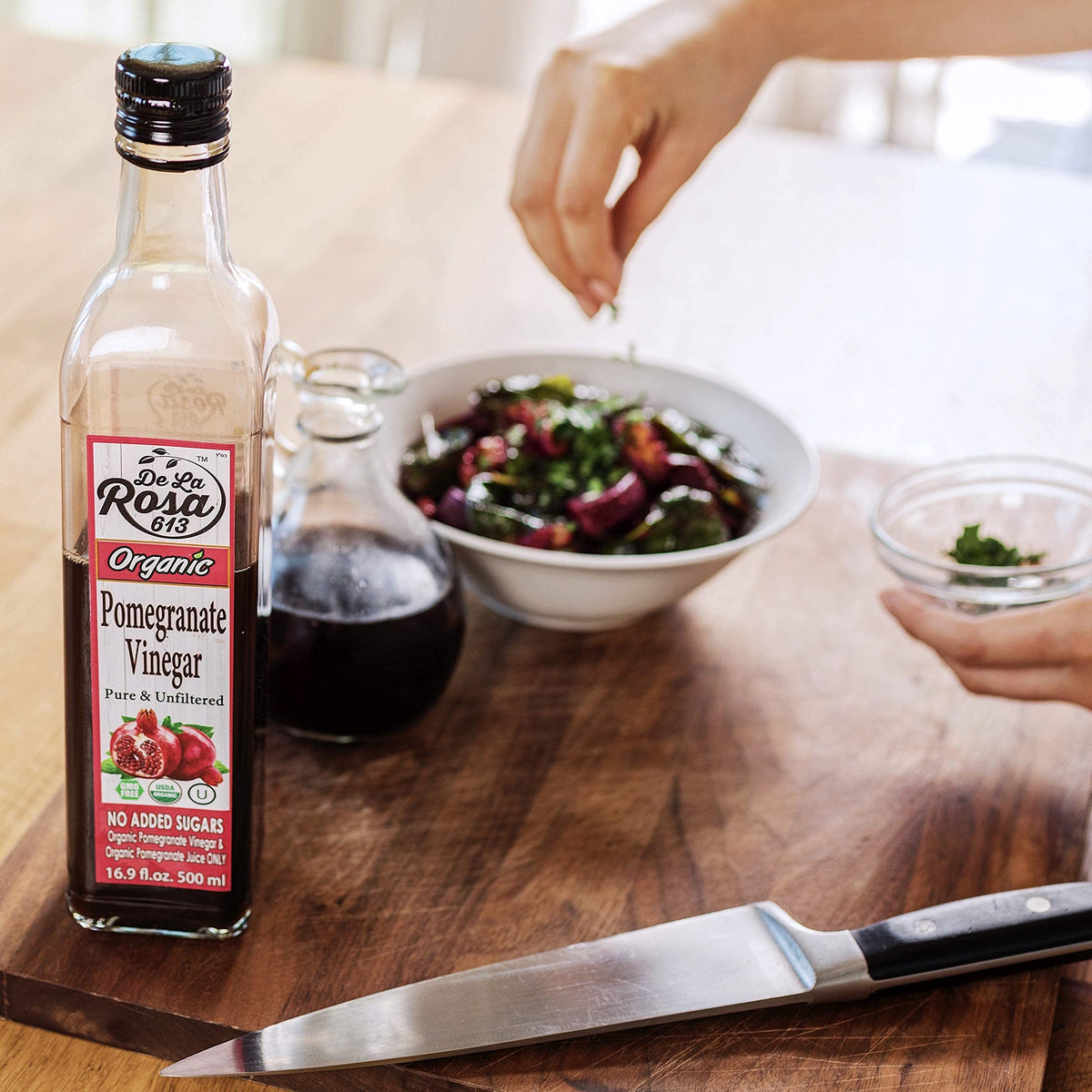 Kitchen scene with De La Rosa 613 pomegranate vinegar within reach