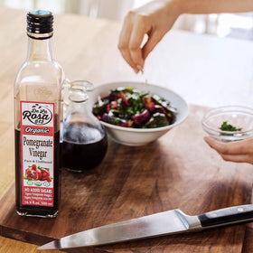 Kitchen scene with De La Rosa 613 pomegranate vinegar within reach